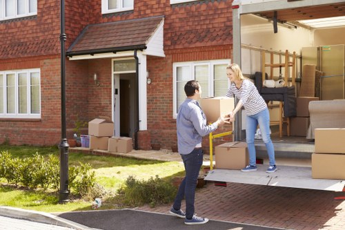 Professional movers handling flat access and stairs in North London