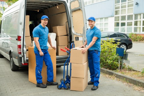 Local moving team loading boxes into a removals van