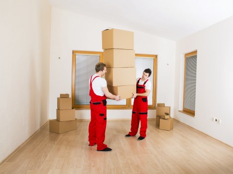 Packed moving boxes and furniture in a local North London property